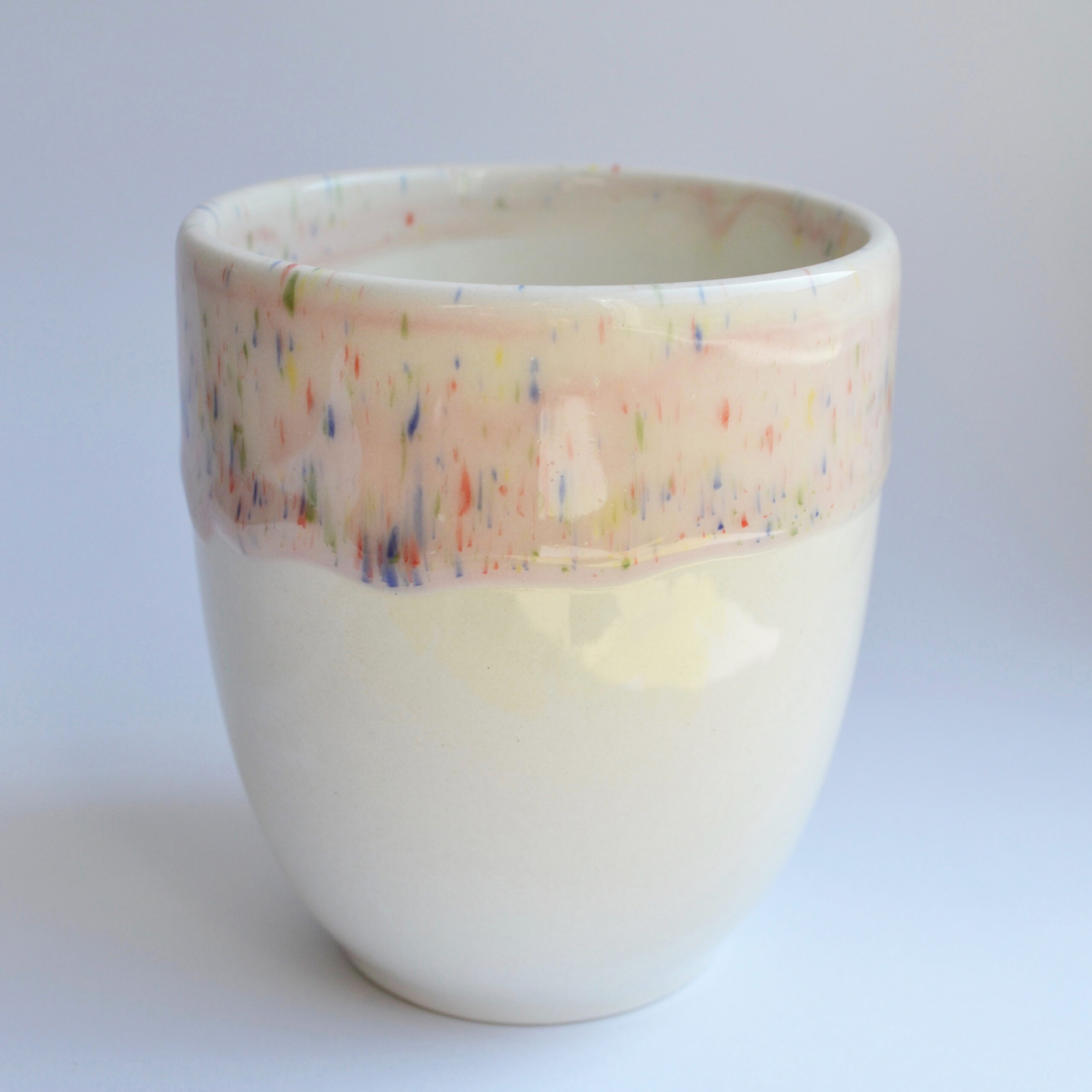 Speckled pinkish glaze cup