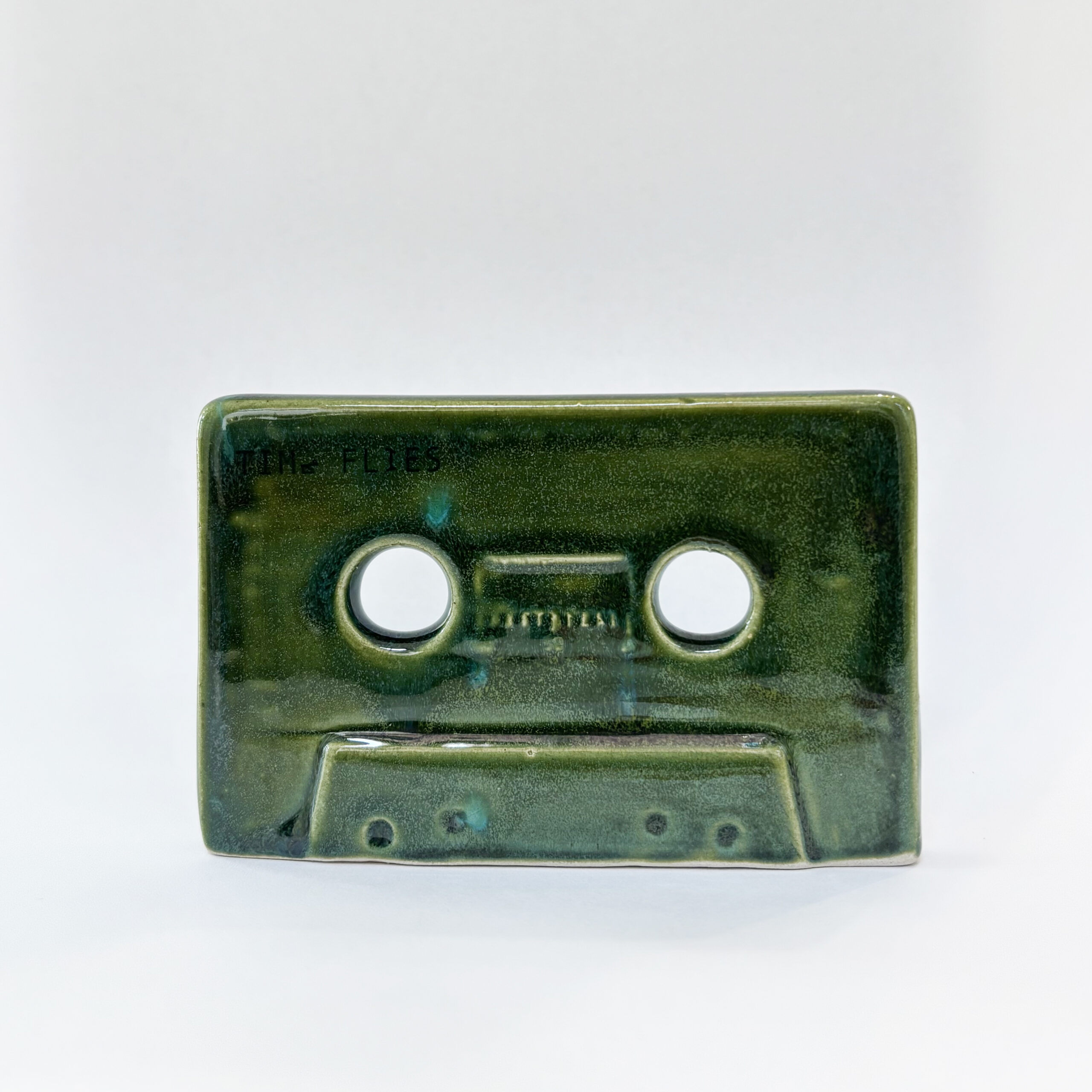 Time flies, cassette tape, deep bottle green